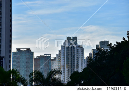 Buildings with trees in the city. Hong Kong Cityscape. Skyscrapers with trees. City and nature concept. 139831848