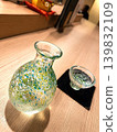 A Japanese sake image featuring a glass sake carafe and sake cups - Japanese modern background material 139832109