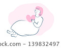 A woman holding a heart 139832497