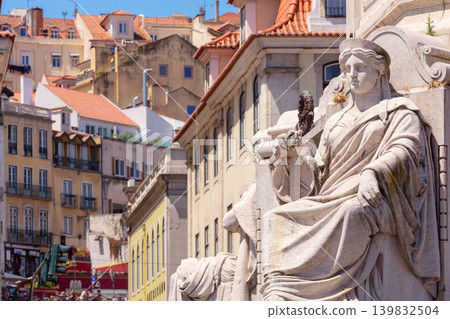 Marble statue at Rossio Square with historic buildings in Lisbon Portugal Marble statue at Rossio Square with historic buildings in Lisbon Portugal 139832504