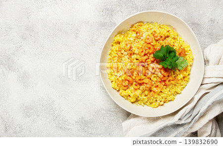 risotto with shrimp, in a bowl, on a textured surface, with a side dish of fresh coriander, homemade, no people, risotto with shrimp, in a bowl, on a textured surface, with a side dish of fresh coriander, homemade, no people, 139832690