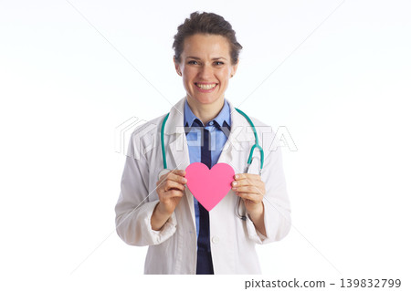 Friendly Female Doctor Holding a Pink Heart Friendly Female Doctor Holding a Pink Heart 139832799