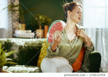 Woman Cooling Down from Summer Heat Woman Cooling Down from Summer Heat 139832956