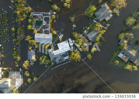 Surrounded by hurricane Ian rainfall flood waters homes in Florida residential area. Aftermath of natural disaster 139833036