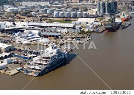Commercial shipyard dock for luxury sea yachts manufacturing. Construction and assembling of deep water ships Commercial shipyard dock for luxury sea yachts manufacturing. Construction and assembling of deep water ships 139833053