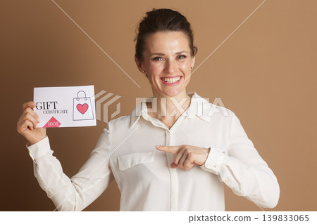 Professional Woman Highlights a Gift Certificate Professional Woman Highlights a Gift Certificate 139833065