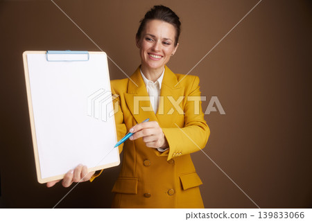 Businesswoman Explaining with Clipboard and Pen Businesswoman Explaining with Clipboard and Pen 139833066