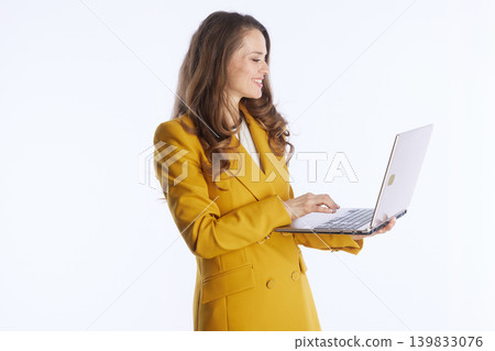 Engaged Executive Typing on Silver Laptop 139833076