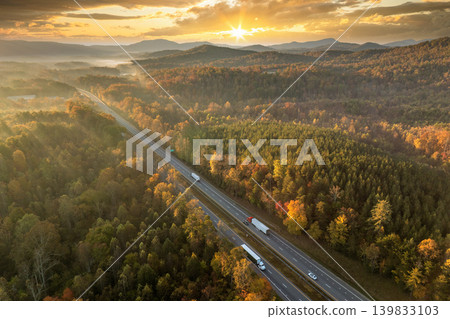 USA highway transportation infrastructure in North Carolina Appalachian mountains. American freeway road with fast driving semi trucks 139833103