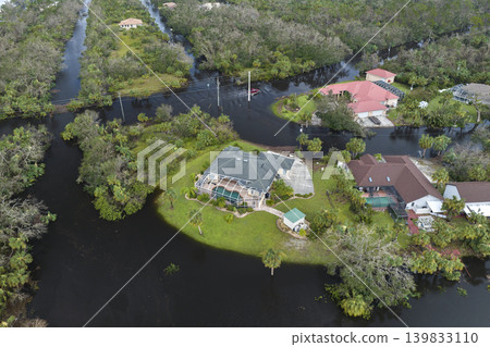 Flooded houses by hurricane Ian rainfall in Florida residential area. Consequences of natural disaster Flooded houses by hurricane Ian rainfall in Florida residential area. Consequences of natural disaster 139833110