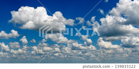 Blue sky with white summer rain clouds. Colorful summer landscape Blue sky with white summer rain clouds. Colorful summer landscape 139833122