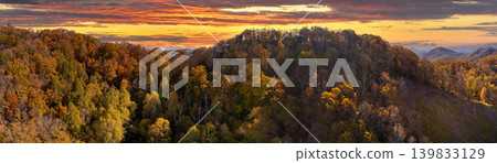 Wooded sunset hills of Appalachian mountains in North Carolina with lush and evergreen forest trees at fall season. Beauty of autumnal nature Wooded sunset hills of Appalachian mountains in North Carolina with lush and evergreen forest trees at fall season. Beauty of autumnal nature 139833129