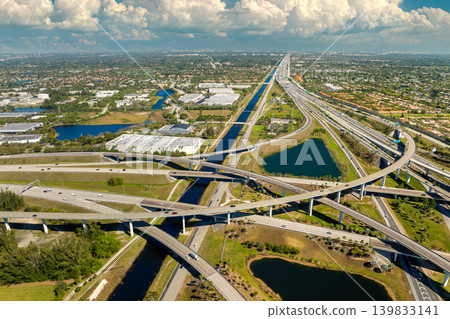 USA car urban transportation infrastructure. American highway junction with fast driving vehicles in Miami, Florida USA car urban transportation infrastructure. American highway junction with fast driving vehicles in Miami, Florida 139833141