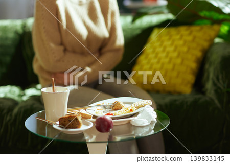 Woman with Stomach Pain After Unhealthy Meal Woman with Stomach Pain After Unhealthy Meal 139833145