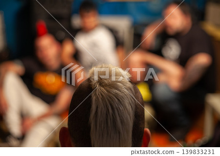Portrait of punk rocker with white mohawk Portrait of punk rocker with white mohawk 139833231