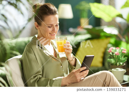 Peaceful Home Moment with Healthy Juice and Smartphone Peaceful Home Moment with Healthy Juice and Smartphone 139833271