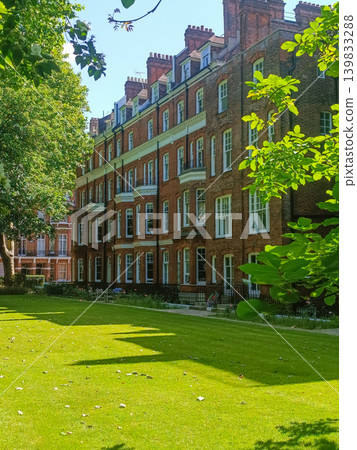 Traditional British apartment block with manicured garden 139833288