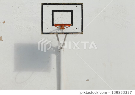 Outdoor basketball hoop and backboard on high school court 139833357