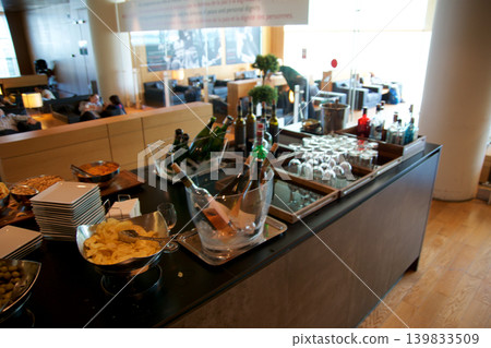 Barcelona, Spain, September 02, 2017: Snack buffet with wine and sparkling wine in a frequent flyer lounge Barcelona, Spain, September 02, 2017: Snack buffet with wine and sparkling wine in a frequent flyer lounge 139833509