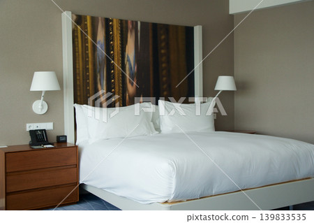 Wroclaw, Poland, June 15, 2018: Sleeping and living area with king size bed in luxury hotel Wroclaw, Poland, June 15, 2018: Sleeping and living area with king size bed in luxury hotel 139833535