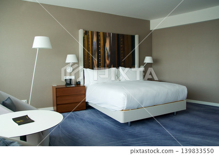 Wroclaw, Poland, June 15, 2018: Sleeping and living area with king size bed in luxury hotel 139833550