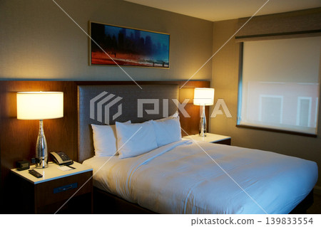 Chicago, United States, May 11 2018: King size bed in luxury hotel on Michigan Avenue Chicago, United States, May 11 2018: King size bed in luxury hotel on Michigan Avenue 139833554