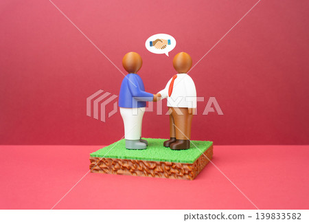 People negotiate a land deal. Buying and selling land. Property investment, contract discussion and commercial negotiations in the real estate market. 139833582