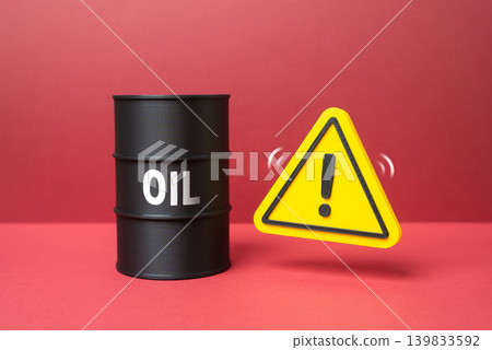 A barrel of oil and a warning sign. Delivery problems, disruption of supply chains. Rising prices and risks for global energy transportation. A barrel of oil and a warning sign. Delivery problems, disruption of supply chains. Rising prices and risks for global energy transportation. 139833592