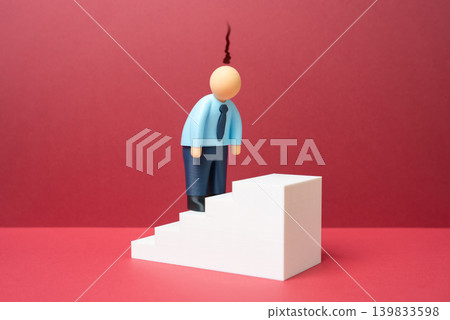 An office worker burned out while climbing the career ladder. Workplace exhaustion, stress overload and emotional fatigue caused by corporate pressure. An office worker burned out while climbing the career ladder. Workplace exhaustion, stress overload and emotional fatigue caused by corporate pressure. 139833598