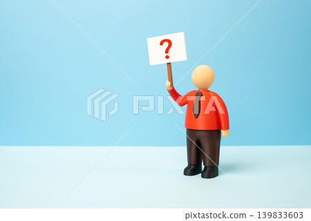 An office worker with a poster and a question mark. What to do next, which career to choose. Answers to questions, guidance and professional uncertainty. An office worker with a poster and a question mark. What to do next, which career to choose. Answers to questions, guidance and professional uncertainty. 139833603