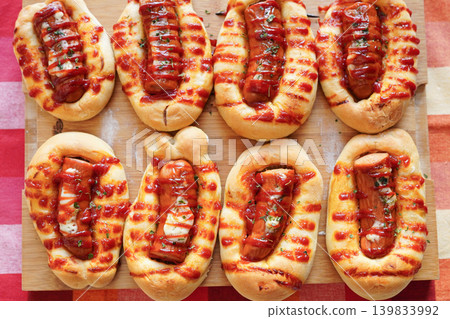 A savory savory bread topped with sausage (wiener) and baked to perfection: Sausage Bread (Wiener Bread) - Overhead View A savory savory bread topped with sausage (wiener) and baked to perfection: Sausage Bread (Wiener Bread) - Overhead View 139833992