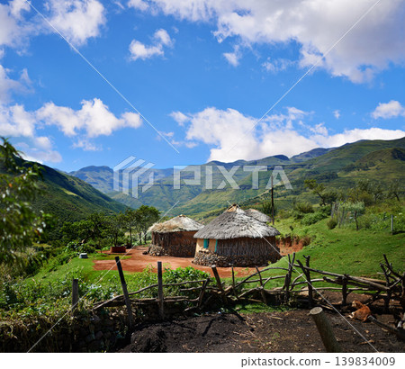 Rural, village and hut in landscape with mountains, nature and summer in countryside of Africa. Cottage, home and travel to remote cabin in bush, field or outdoor in natural environment with houses Rural, village and hut in landscape with mountains, nature and summer in countryside of Africa. Cottage, home and travel to remote cabin in bush, field or outdoor in natural environment with houses 139834009
