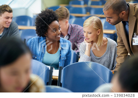 University student, teacher and classroom or test help in lecture hall or education, scholarship or learning. Female people, friends and professor or paperwork at college academy, teaching or London 139834028