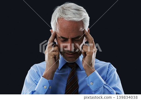 Stress, CEO and thinking in studio with anxiety for meeting, public speaking or presentation. Mature male person, leader and hand on temples for headache, ideas or frustrated on black background 139834038