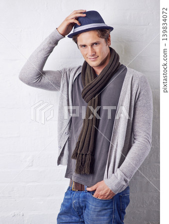 Hat, fashion and portrait of man by wall with casual, cool and trendy outfit for confidence. Smile, handsome and happy young male person with attractive style standing by white brick background. Hat, fashion and portrait of man by wall with casual, cool and trendy outfit for confidence. Smile, handsome and happy young male person with attractive style standing by white brick background. 139834072