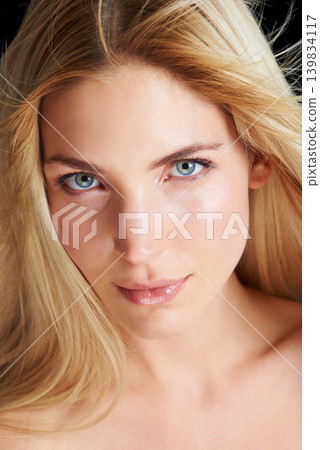 Beauty, haircare and portrait of woman in studio with natural straight hairstyle, luxury salon care and keratin treatment. Styling, shine and girl with healthy hair, confidence and serious face. Beauty, haircare and portrait of woman in studio with natural straight hairstyle, luxury salon care and keratin treatment. Styling, shine and girl with healthy hair, confidence and serious face. 139834117