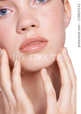 Closeup, skincare and woman in studio with face, hands and white background with natural for beauty, glow and healthy skin. Confident, self care and treatment for smooth, pure and perfect texture Closeup, skincare and woman in studio with face, hands and white background with natural for beauty, glow and healthy skin. Confident, self care and treatment for smooth, pure and perfect texture 139834141