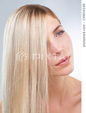 Straight hair, beauty and serious woman in makeup, care or thinking isolated on a white studio background. Face, hairstyle and blonde model in cosmetics, hairdresser and salon treatment for keratin Straight hair, beauty and serious woman in makeup, care or thinking isolated on a white studio background. Face, hairstyle and blonde model in cosmetics, hairdresser and salon treatment for keratin 139834189