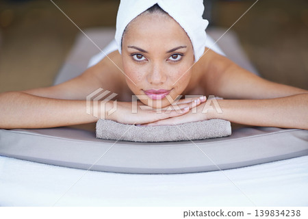 Spa, woman and portrait on massage bed with relax for wellness, zen and beauty treatment for body care. Person, face and stress relief at resort, salon table and peaceful on holiday or vacation 139834238