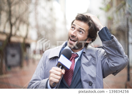 Weather, man and reporting on rainstorm, smile and journalism with media and breaking news. Feedback, person and employee with a microphone or professional in New York city with information or anchor Weather, man and reporting on rainstorm, smile and journalism with media and breaking news. Feedback, person and employee with a microphone or professional in New York city with information or anchor 139834256