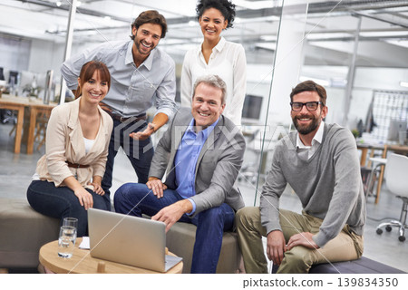 Businesspeople, portrait and laptop for teamwork at in office at creative agency for project planning, campaign or proposal. Men, women and smile or together for collaboration, internet or meeting 139834350