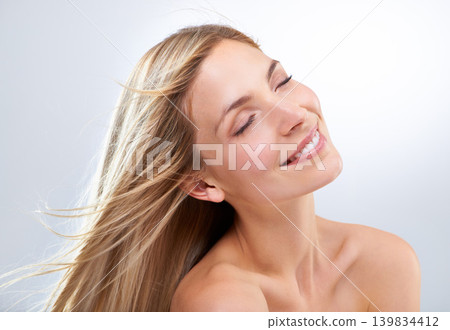 Beauty, hair and face of woman in studio with natural makeup, smile and straight balayage hairstyle. Haircare, cosmetics and happy model with keratin growth, relax and girl on white background. 139834412