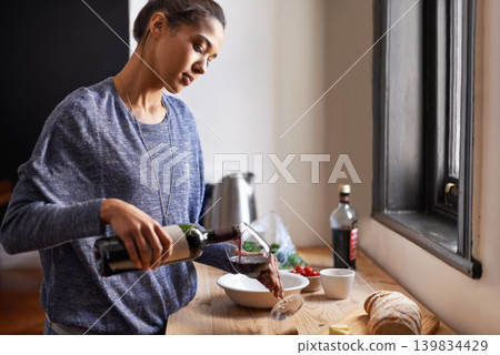 Woman, pour wine and home for dinner, relax for peace and leisure with drink in kitchen. Alcohol, glass and bottle with refreshment, hydration with beverage to celebrate or chill in apartment Woman, pour wine and home for dinner, relax for peace and leisure with drink in kitchen. Alcohol, glass and bottle with refreshment, hydration with beverage to celebrate or chill in apartment 139834429