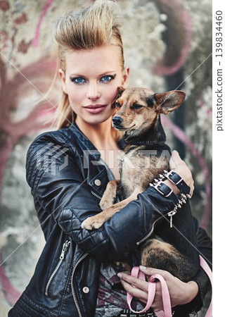 Dog, portrait and confident woman in fashion in city and bonding with chihuahua in cool style. London, designer and face in edgy leather clothes in town, unique and care for pet animal by street art Dog, portrait and confident woman in fashion in city and bonding with chihuahua in cool style. London, designer and face in edgy leather clothes in town, unique and care for pet animal by street art 139834460