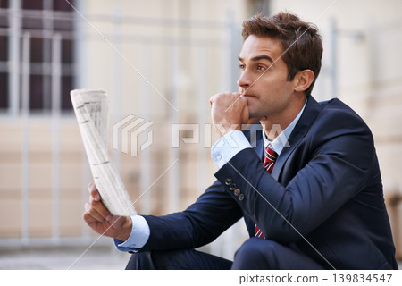 Thinking, business man and newspaper outdoor in city for opportunity, dream and reading. Paper, vision and consultant in urban town with decision, inspiration and serious employee planning future Thinking, business man and newspaper outdoor in city for opportunity, dream and reading. Paper, vision and consultant in urban town with decision, inspiration and serious employee planning future 139834547