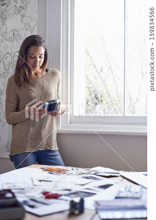 Woman, photographer and vintage camera in creative studio with images of portfolio or art project, proposal or career. Female person, equipment and pictures or concept board or retro, hobby or prints Woman, photographer and vintage camera in creative studio with images of portfolio or art project, proposal or career. Female person, equipment and pictures or concept board or retro, hobby or prints 139834566