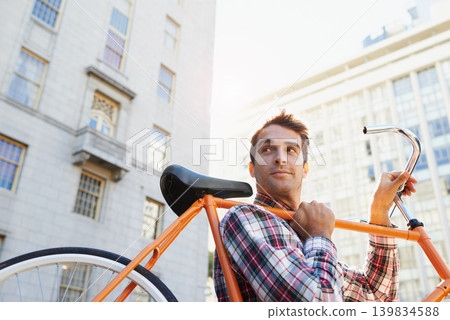 Man, lifting bicycle and smile for travel, commute or journey to apartment in Chicago from behind. Male person, happy and road bike for sustainability, environmentally friendly and mobility in city Man, lifting bicycle and smile for travel, commute or journey to apartment in Chicago from behind. Male person, happy and road bike for sustainability, environmentally friendly and mobility in city 139834588