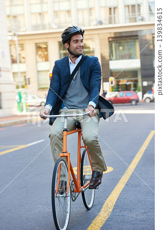 Morning, commute and city road of businessman with bicycle for green and sustainable transportation. Cyclist, smile and bike for carbon footprint in New York by urban street with entrepreneur cycling 139834615