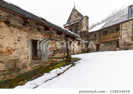 Snowy stone streets and buildings in a picturesque town in the Spanish province of Leon, called Colinas del Campo 139834659