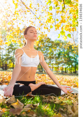 Woman, park and mediation on relaxation with peace for stress relief, break and focus for comfort and wellness. Spirituality, serenity and awareness for selfcare with calm, mindful and positivity. Woman, park and mediation on relaxation with peace for stress relief, break and focus for comfort and wellness. Spirituality, serenity and awareness for selfcare with calm, mindful and positivity. 139834686